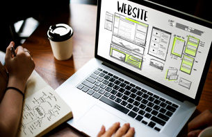 Website Design and Development Wireframe on Laptop