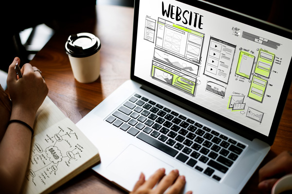 Website Design and Development Wireframe on Laptop Website Design and Development Wireframe on Laptop