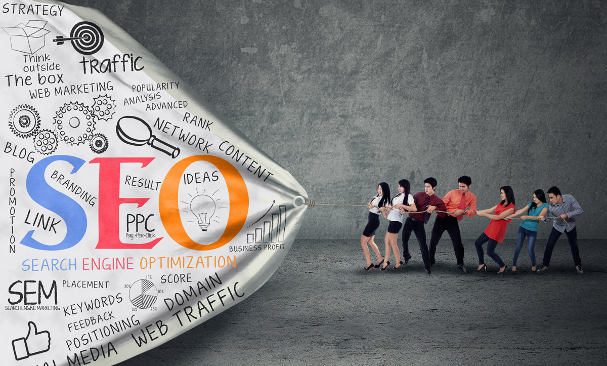 Team pulling marketing banner that says seo sem ppc social media etc. Team pulling marketing banner that says seo sem ppc social media etc.