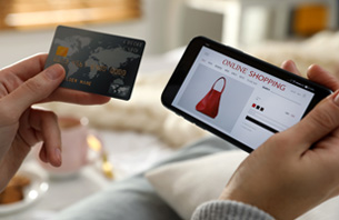 Woman online shopping on smartphone